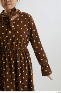 Aera  1 arm brown dots dress casual dressed flexing…